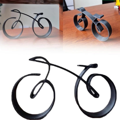 Minimalistisk cykelskulptur i metal med mat trådlook