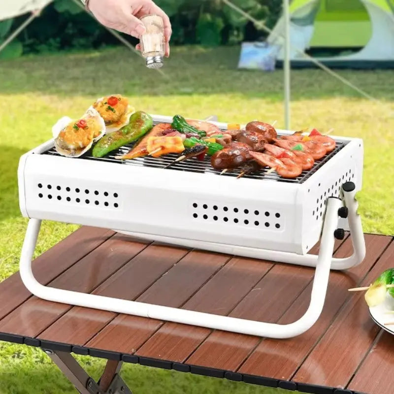 Bærbar kulgrill med sammenklappelige håndtag