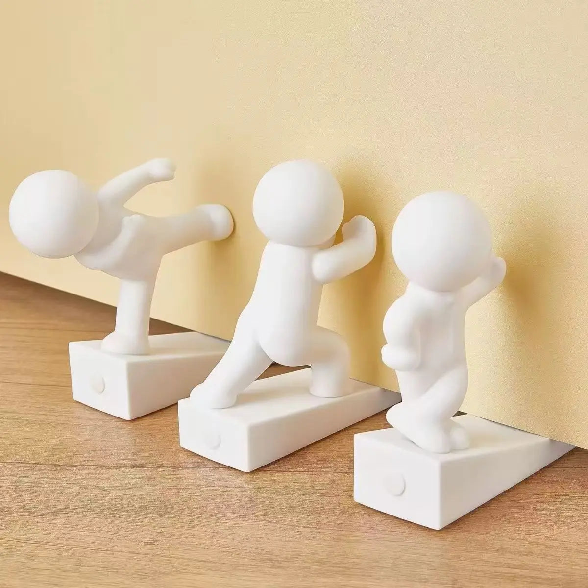 Dekorativ dørstopper i gummi med figurmotiv