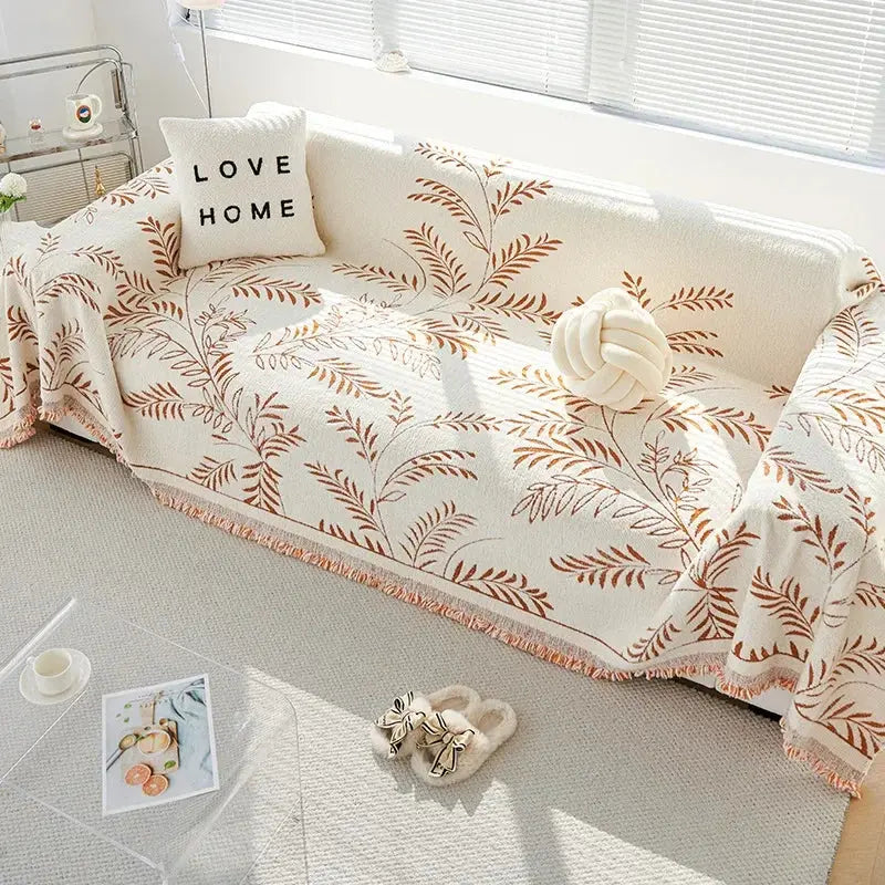 Sofaoverkast i chenille med jacquardvævede blade