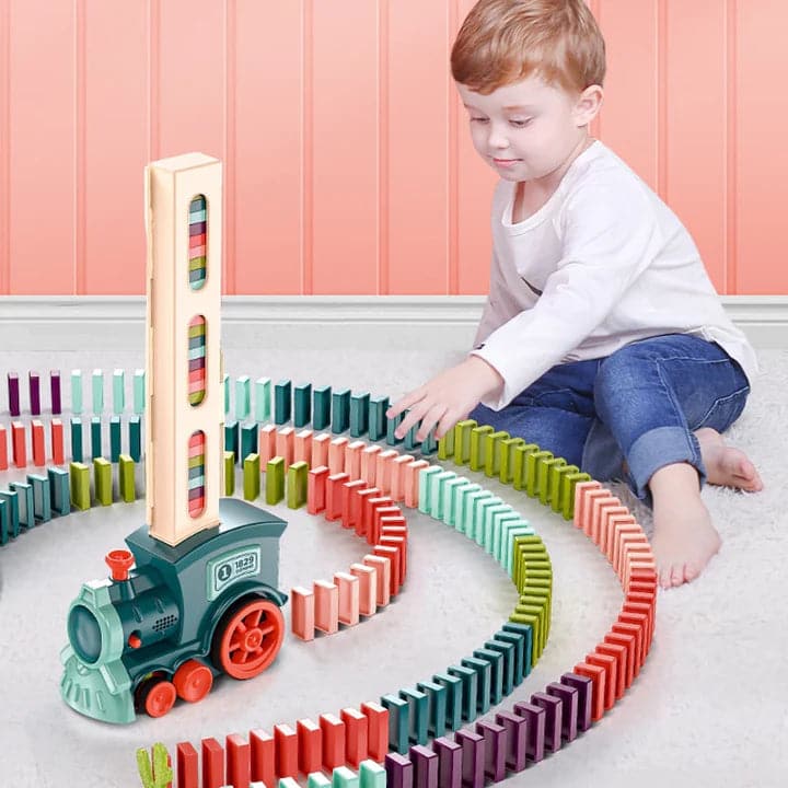 Dominotog til børn med automatisk opstilling af brikker