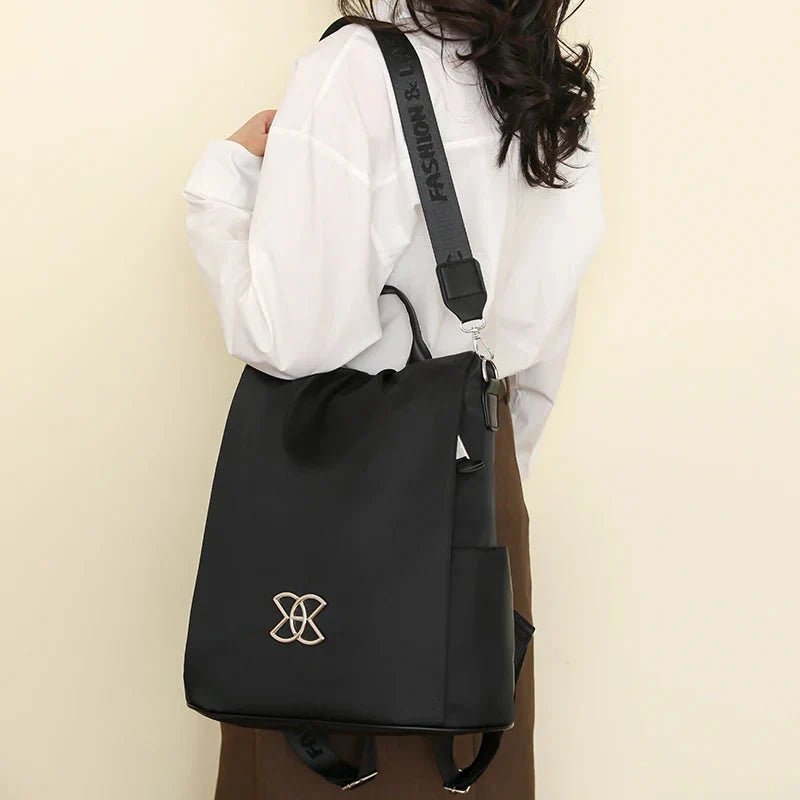 Multifunktionel tyverisikret crossbody-taske