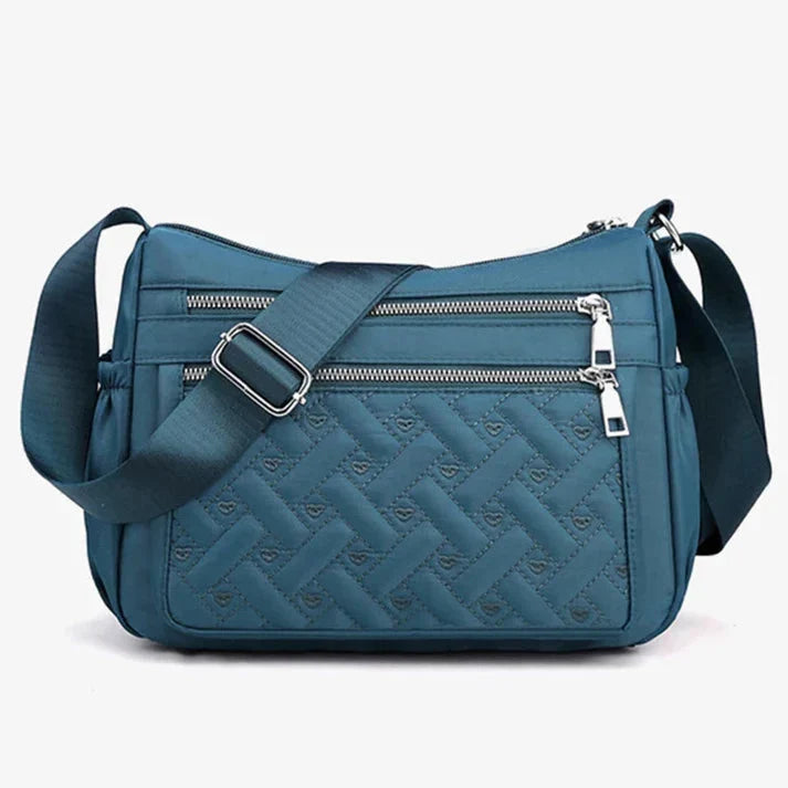 Let skuldertaske i nylon med flere rum