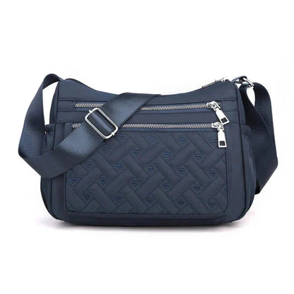 Let skuldertaske i nylon med flere rum