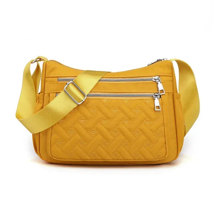 Let skuldertaske i nylon med flere rum