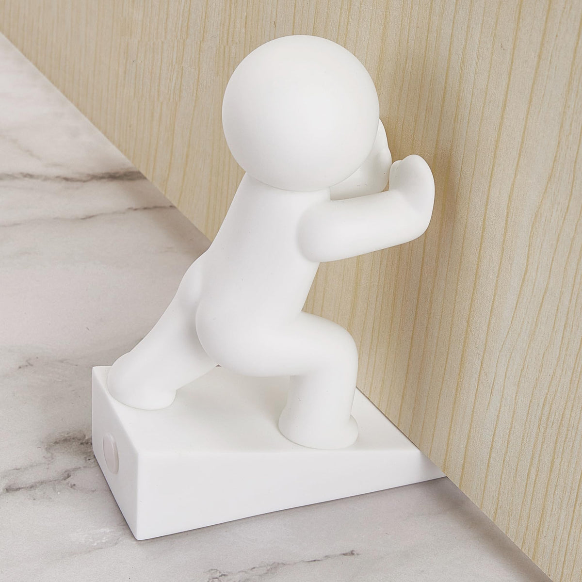 Dekorativ dørstopper i gummi med figurmotiv