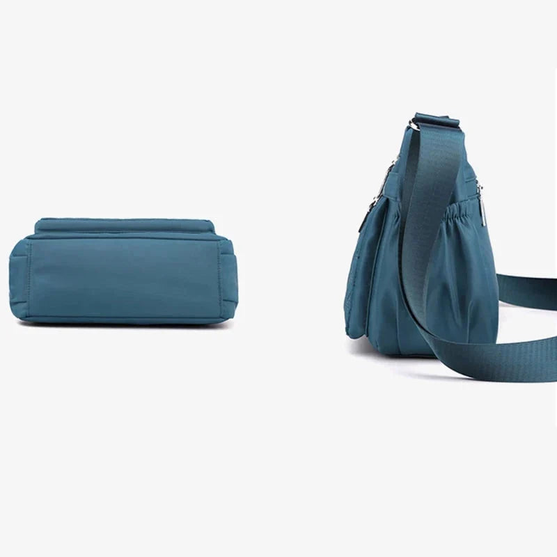 Let skuldertaske i nylon med flere rum