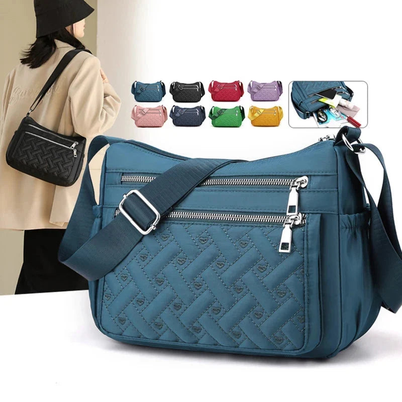 Let skuldertaske i nylon med flere rum