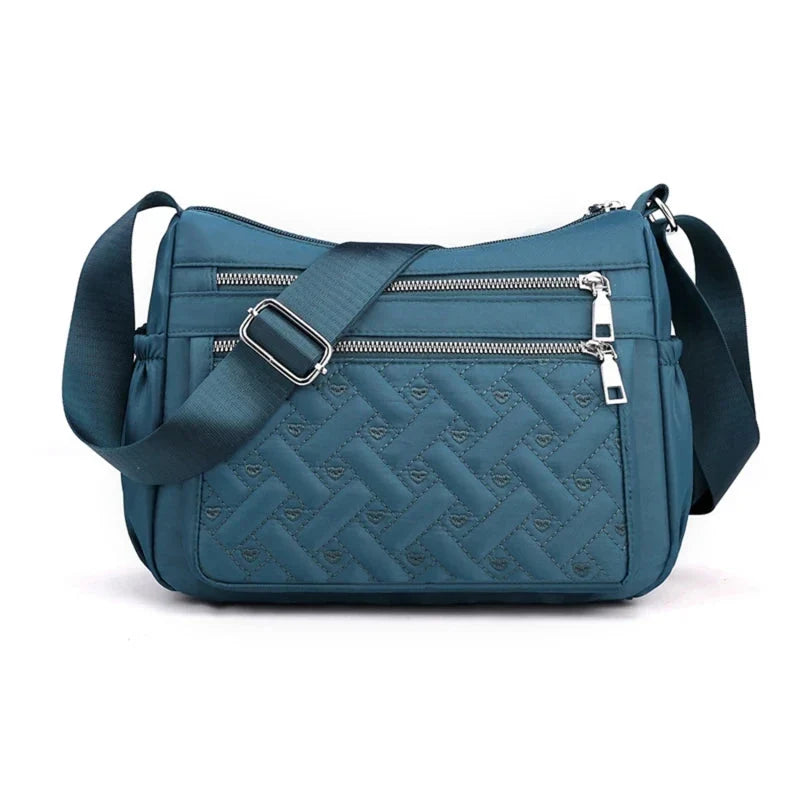 Let skuldertaske i nylon med flere rum