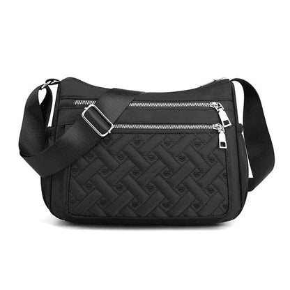 Let skuldertaske i nylon med flere rum