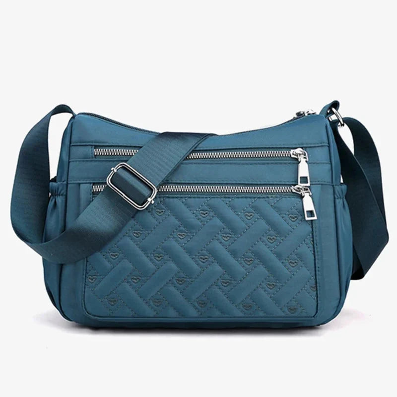 Let skuldertaske i nylon med flere rum