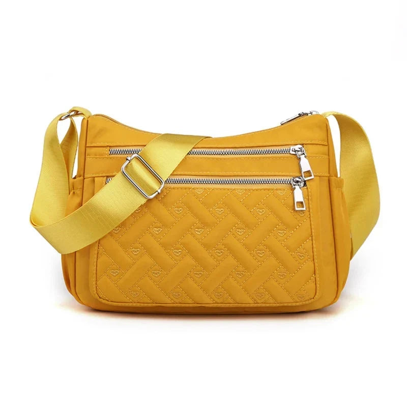 Let skuldertaske i nylon med flere rum